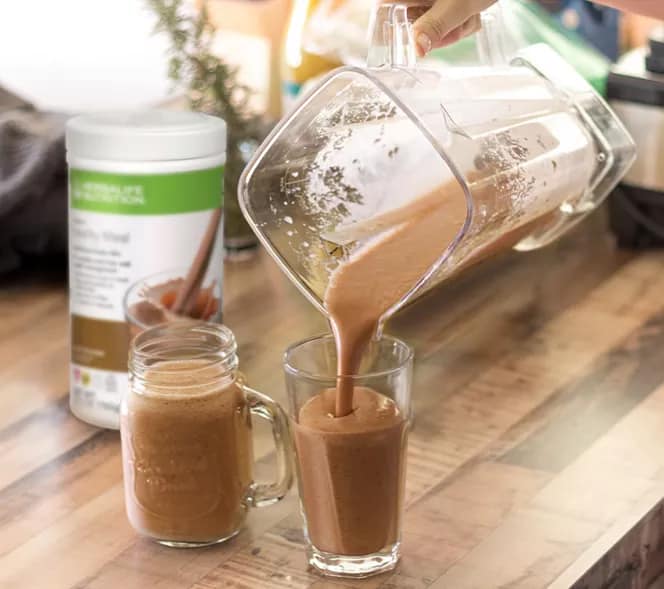 Fitness with herbalife: The complete guide to staying healthyu in 2025 ps chocolate shake poured into glasses